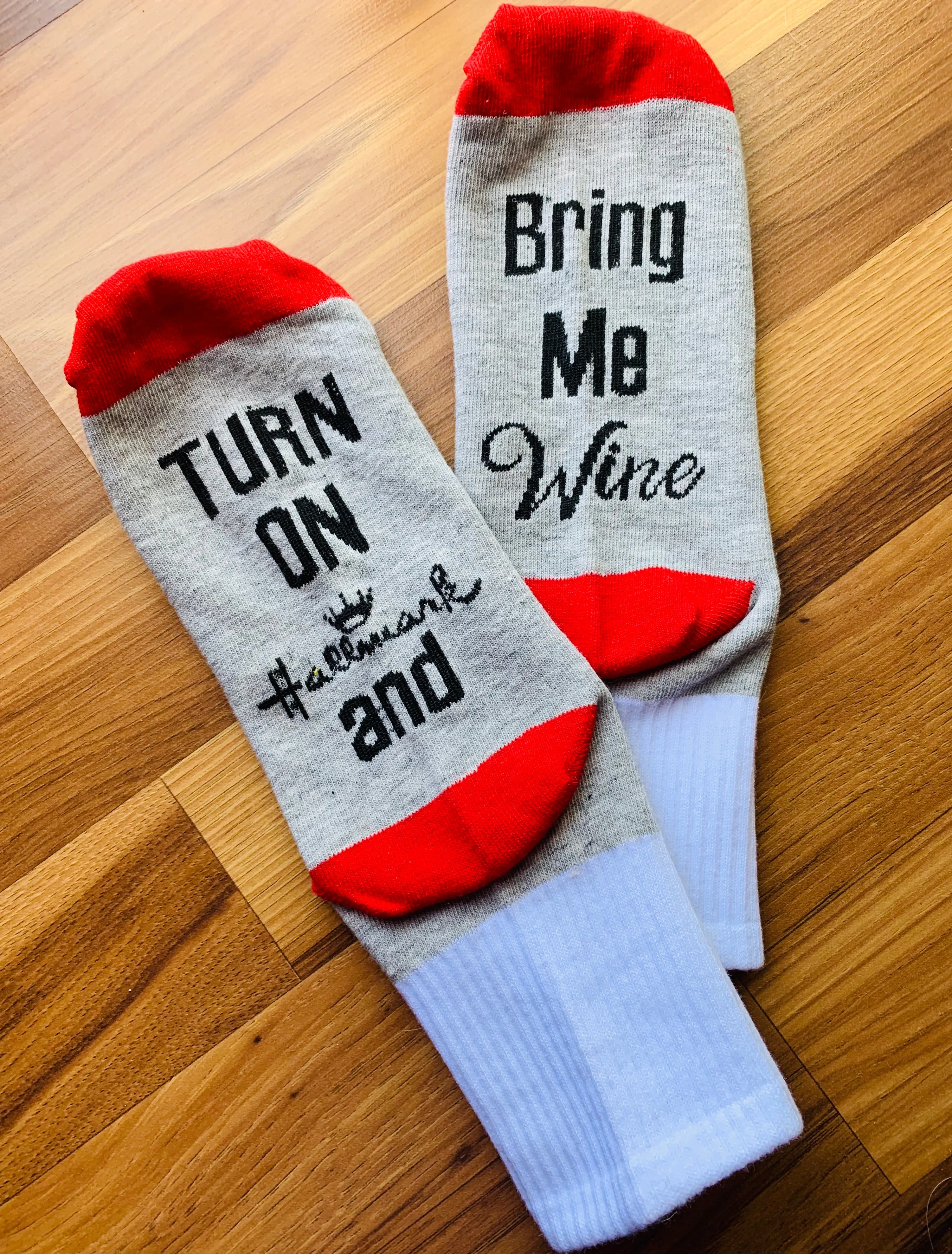 Socks { Turn on Hallmark & bring me w ine } Red and gray with black letters.