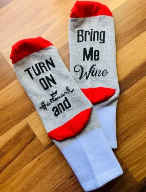 Socks { Turn on Hallmark & bring me w ine } Red and gray with black letters.